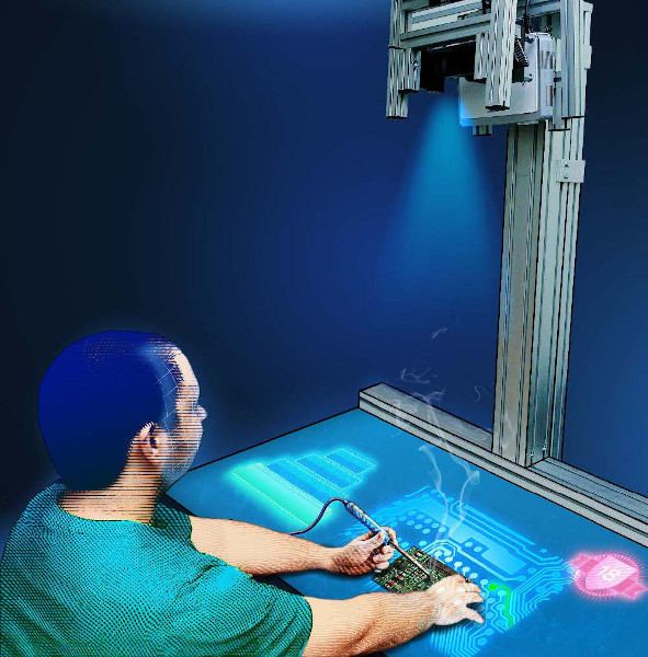 Ein Mann sitzt an einem Tisch auf dem verschiedene Formen projiziert werden. Auf dieser Tischplatte lötet er etwas an einer Platte.